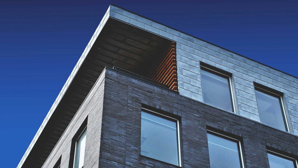 a building with windows and a balcony to give you an example of Chain of Title for this building
