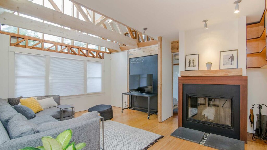 a living room with a fireplace and a couch and example of home title vesting vesting deed 