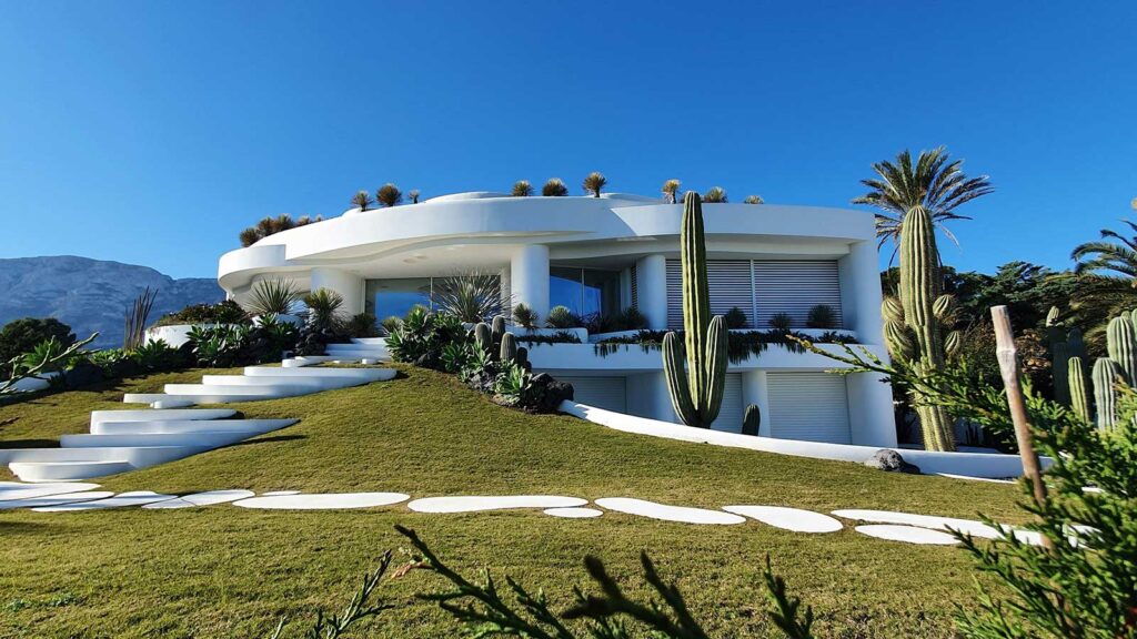 a house with a large yard and a cactus property related to title vesting vesting deed 