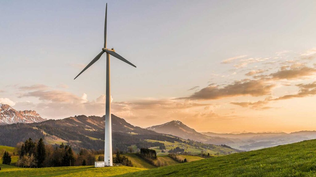 a windmill in a grassy field with depecits Environmental Site Assessment