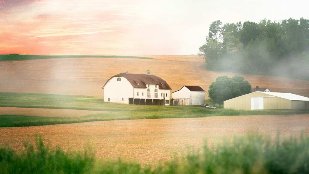 a white barn and two white buildings in a farm field in Pennsylvania Property Title Search