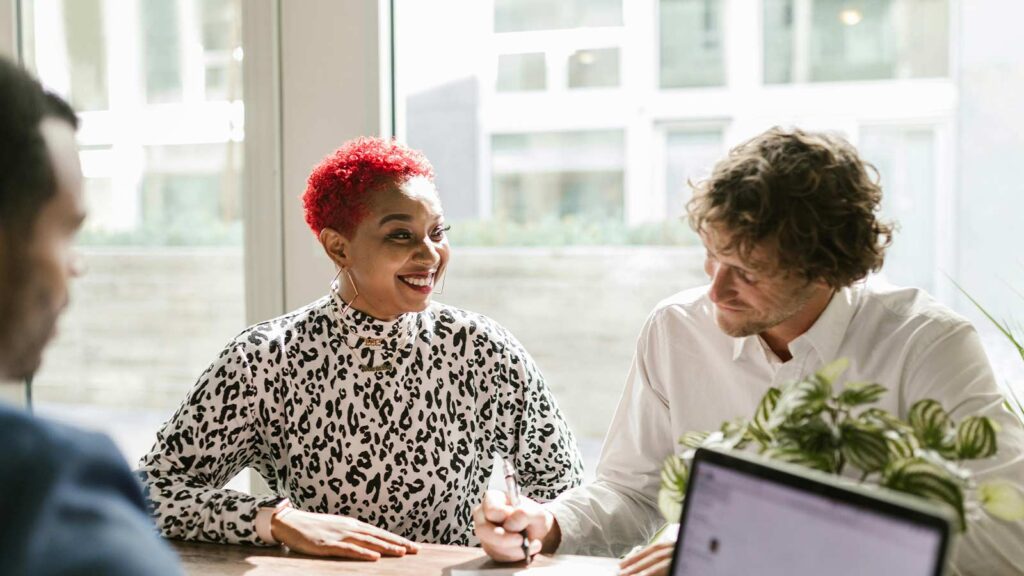 a man and woman sitting at a table discussing Pennsylvania Property Title Search