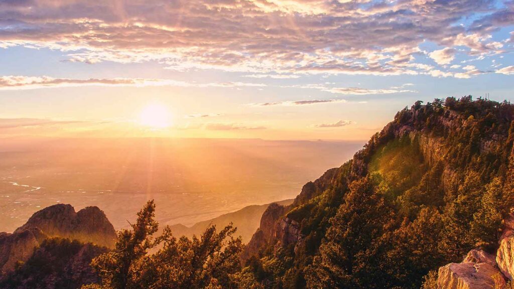 Sunset over mountains and valley AI Title Search in New Mexico