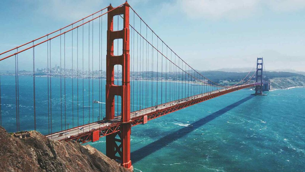 Golden Gate Bridge over blue water AI title search in California